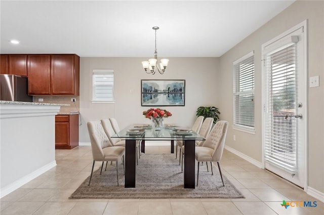 3907 Gentle Mdw, New Braunfels, TX 78130 - dining room featuring a chandelier, plenty of natural light, light tile patterned floors, and baseboards