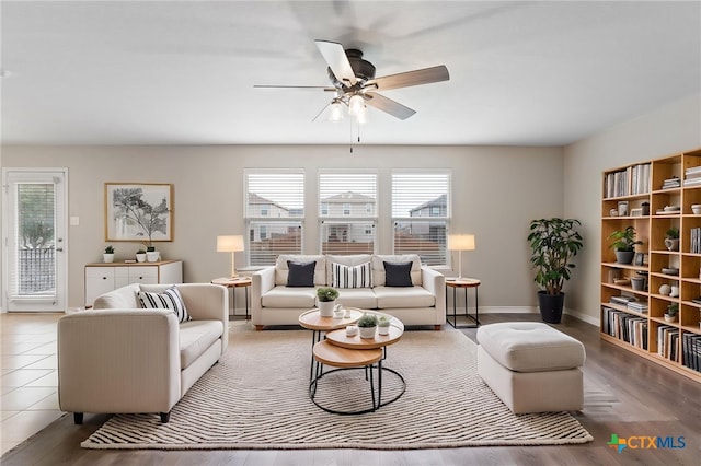 3907 Gentle Mdw, New Braunfels, TX 78130 - living area with a ceiling fan, wood finished floors, and baseboards