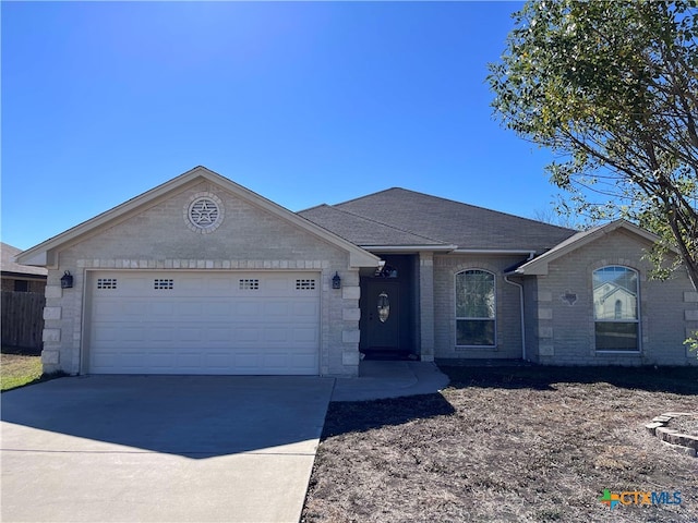 ranch-style house featuring a garage