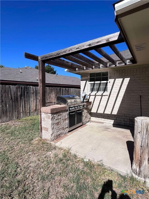 view of patio featuring area for grilling and an outdoor kitchen