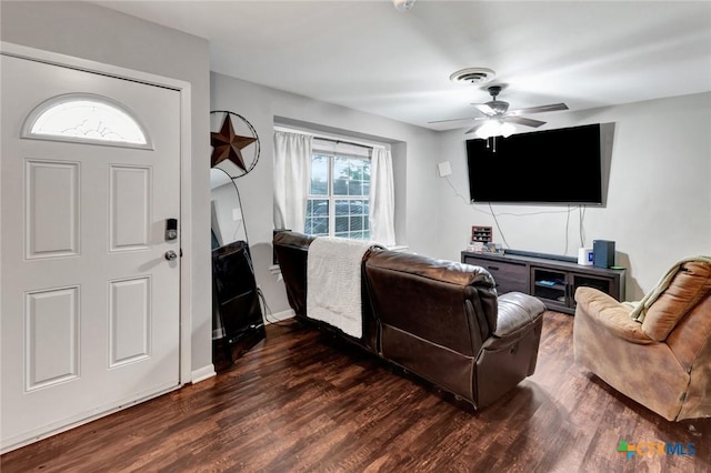 1808 Mission Dr, Victoria, TX 77901 - living area featuring dark wood-style floors, ceiling fan, and baseboards