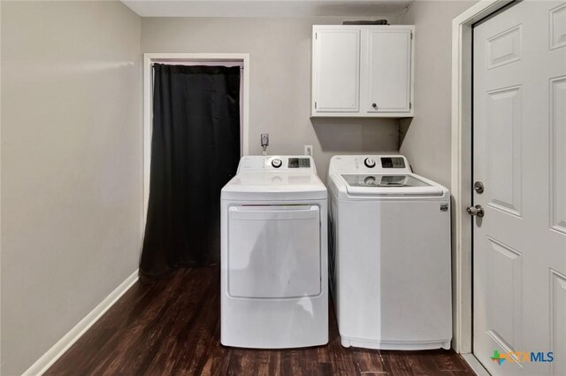 1808 Mission Dr, Victoria, TX 77901 - laundry room featuring washing machine and dryer, cabinet space, dark wood-style flooring, and baseboards