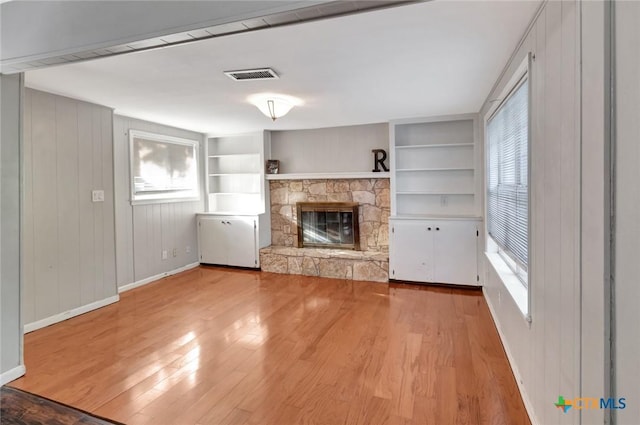 1808 Mission Dr, Victoria, TX 77901 - unfurnished living room with healthy amount of natural light, baseboards, and light wood-style flooring