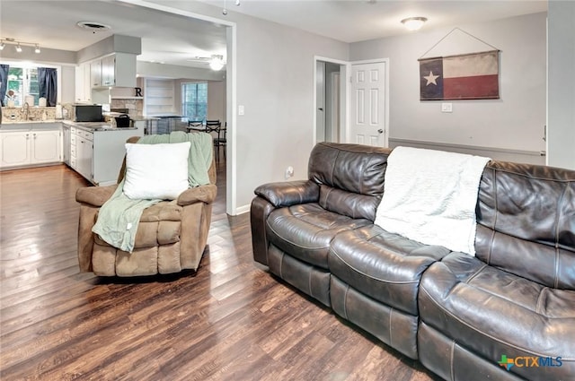 1808 Mission Dr, Victoria, TX 77901 - living room with dark wood finished floors, baseboards, and ceiling fan