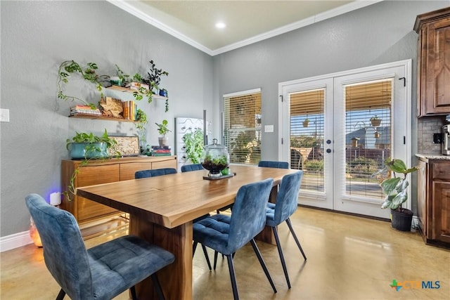 dining room featuring french doors and ornamental molding