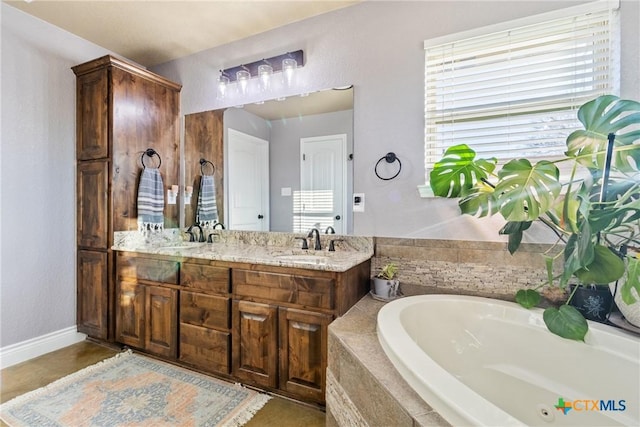 bathroom with vanity and tiled tub