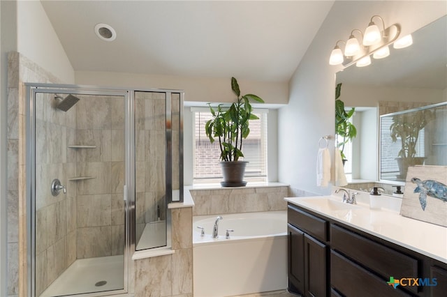 521 Kirkhill St, Hutto, TX 78634 - full bathroom with vanity, a bath, a stall shower, and lofted ceiling