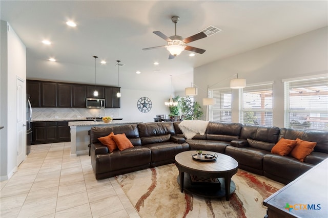 521 Kirkhill St, Hutto, TX 78634 - living room featuring lofted ceiling, light tile patterned floors, recessed lighting, and a ceiling fan