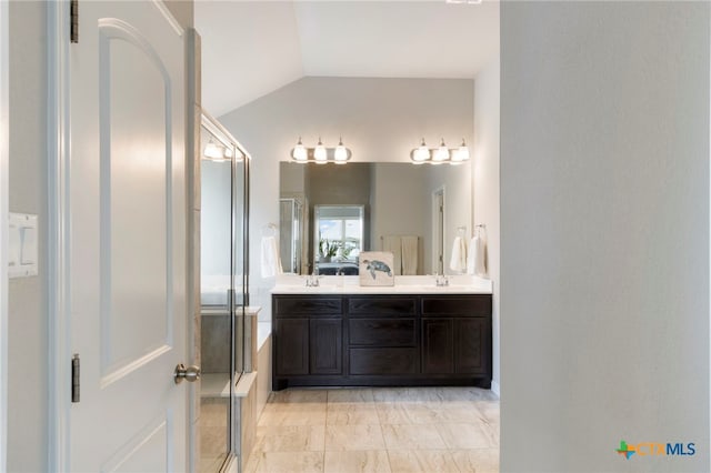 521 Kirkhill St, Hutto, TX 78634 - full bath with vaulted ceiling, a shower with door, double vanity, and marble look tiles
