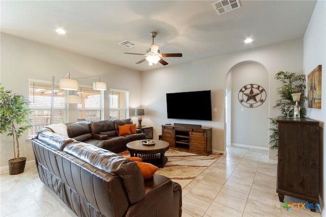 521 Kirkhill St, Hutto, TX 78634 - living area with arched walkways, a ceiling fan, recessed lighting, and baseboards