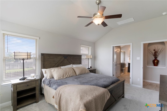 521 Kirkhill St, Hutto, TX 78634 - bedroom with lofted ceiling, light carpet, baseboards, ceiling fan, and connected bathroom