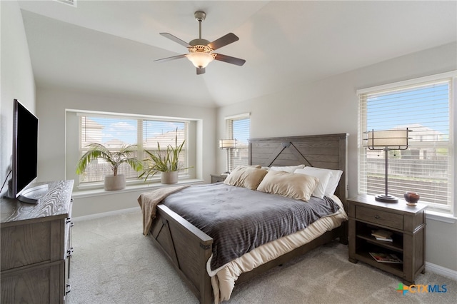 521 Kirkhill St, Hutto, TX 78634 - bedroom featuring light colored carpet, multiple windows, baseboards, vaulted ceiling, and ceiling fan