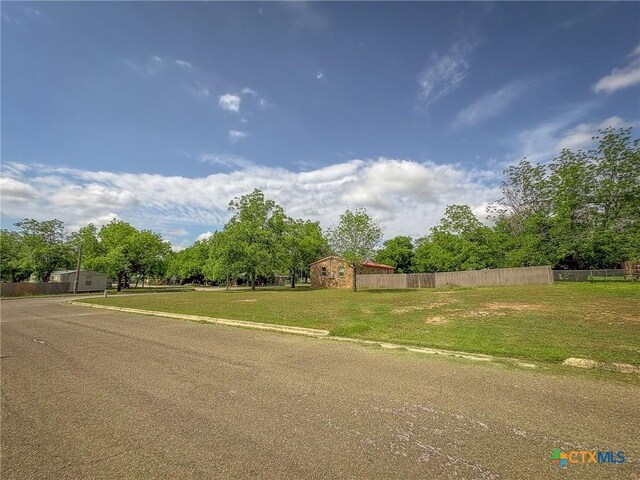 1003 Standifer St, Lampasas, TX 76550 - view of asphalt street with curbs and view of scattered trees