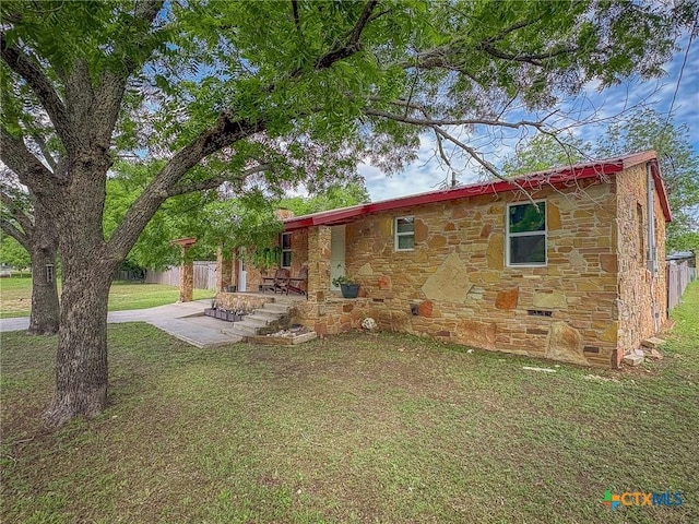 1003 Standifer St, Lampasas, TX 76550 - view of front of home with stone siding, a patio, and crawl space