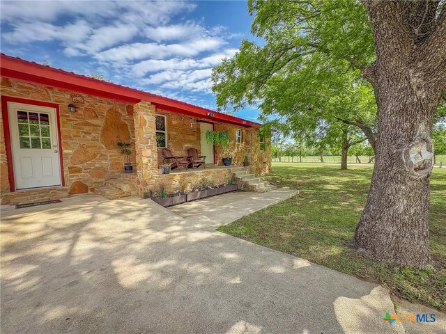 1003 Standifer St, Lampasas, TX 76550 - view of green lawn with covered porch