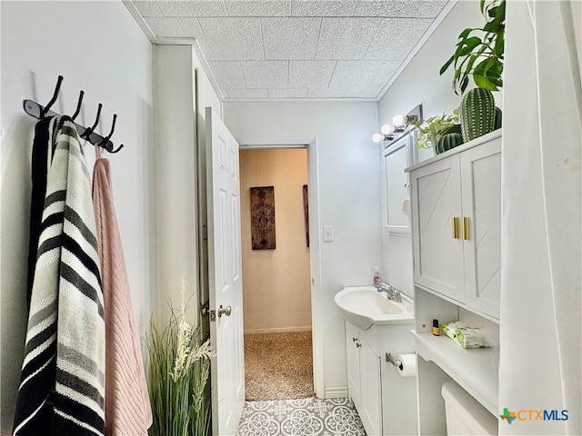 1003 Standifer St, Lampasas, TX 76550 - bathroom with vanity and baseboards