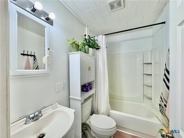 1003 Standifer St, Lampasas, TX 76550 - bathroom featuring a sink, shower / bath combination with curtain, and toilet