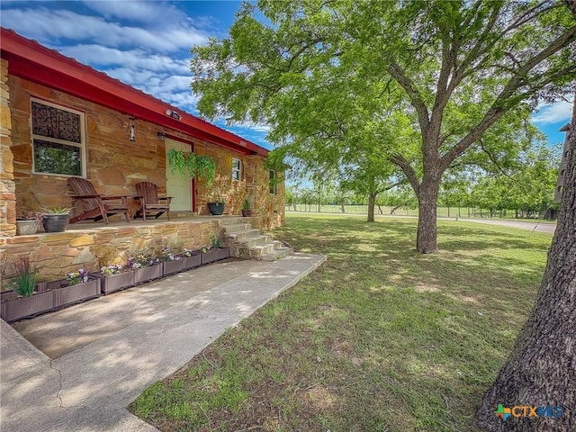 1003 Standifer St, Lampasas, TX 76550 - view of grassy yard featuring a porch