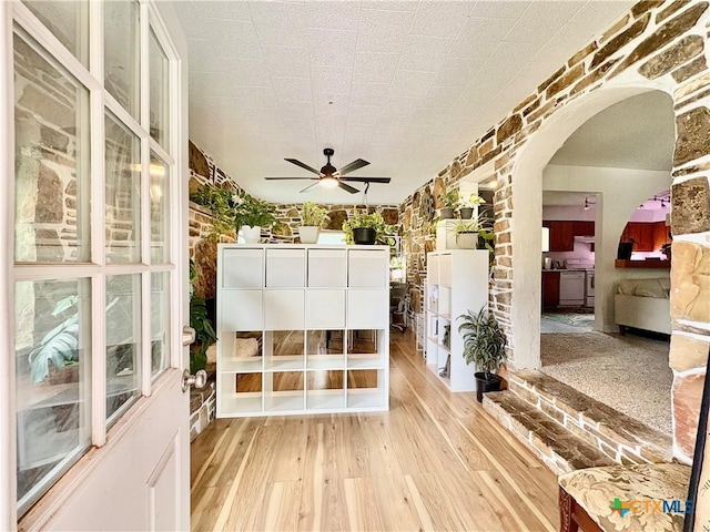 1003 Standifer St, Lampasas, TX 76550 - interior space with light wood-style flooring, arched walkways, and ceiling fan