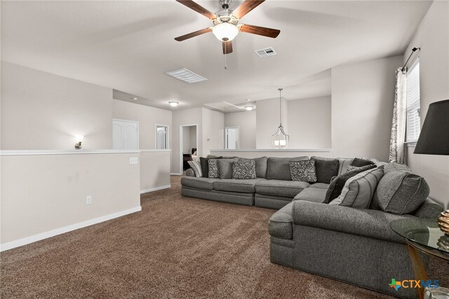 living room with carpet flooring and ceiling fan