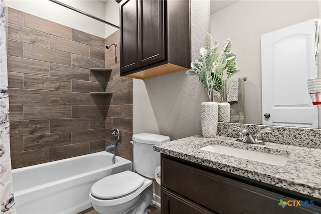 full bathroom with vanity, toilet, and shower / tub combo