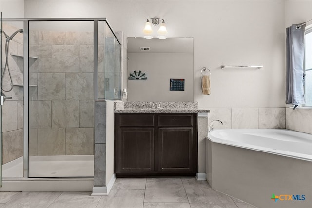 bathroom featuring vanity and plus walk in shower