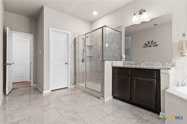 bathroom featuring vanity and independent shower and bath