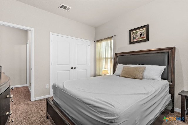 bedroom with a closet and carpet