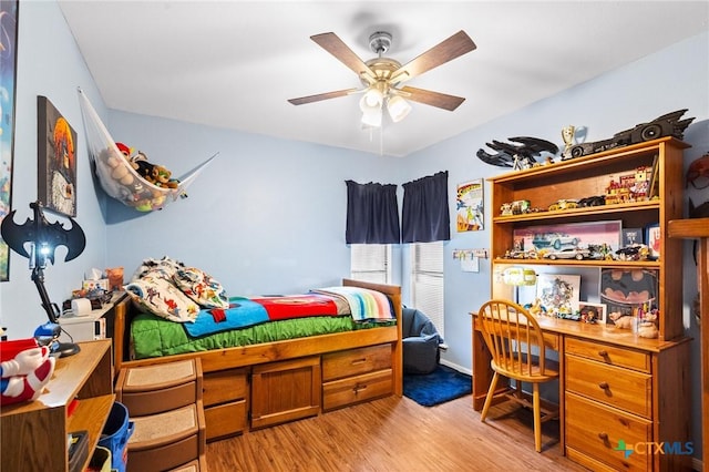 216 Ridge Dr, Victoria, TX 77904 - bedroom with light wood finished floors and a ceiling fan
