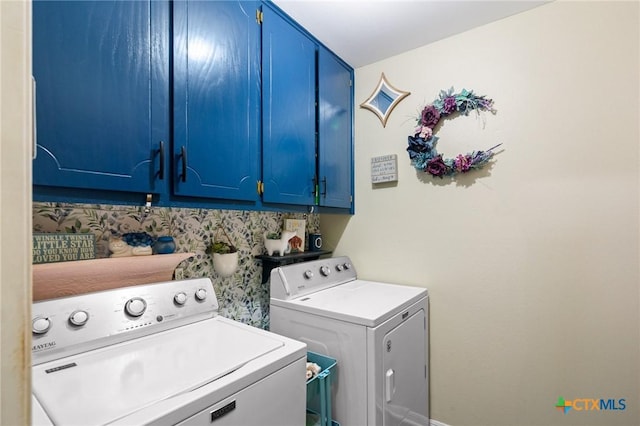 216 Ridge Dr, Victoria, TX 77904 - laundry room with cabinet space and washing machine and dryer