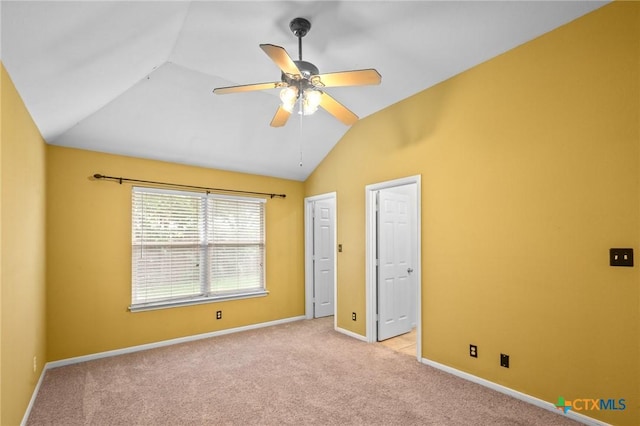 908 Pennsylvania Ave, Victoria, TX 77904 - unfurnished bedroom featuring lofted ceiling, light carpet, and ceiling fan