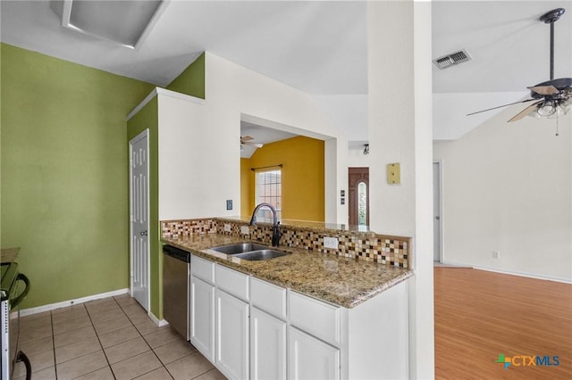 908 Pennsylvania Ave, Victoria, TX 77904 - kitchen with a ceiling fan, dishwasher, vaulted ceiling, stove, and backsplash