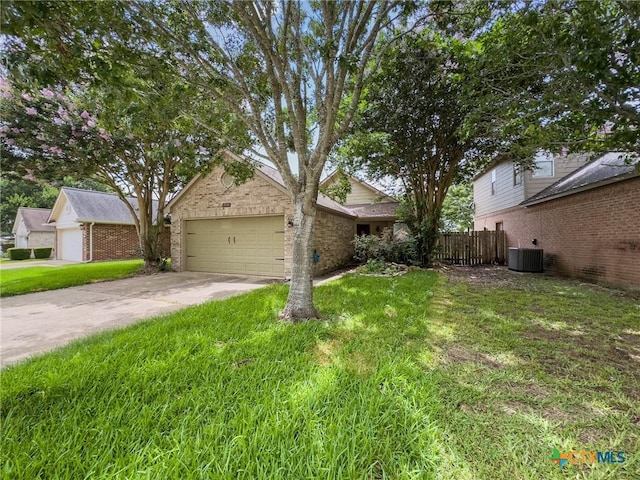 908 Pennsylvania Ave, Victoria, TX 77904 - obstructed view of property with brick siding, driveway, and a garage