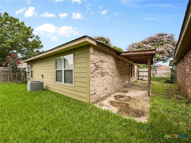 908 Pennsylvania Ave, Victoria, TX 77904 - view of property exterior featuring brick siding and a central air condition unit