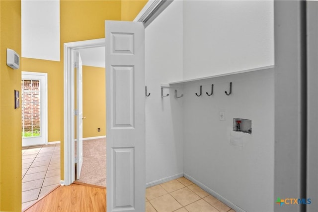 908 Pennsylvania Ave, Victoria, TX 77904 - washroom with washer hookup and light tile patterned floors