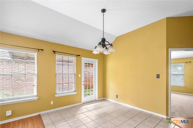 908 Pennsylvania Ave, Victoria, TX 77904 - spare room with healthy amount of natural light, lofted ceiling, and a chandelier