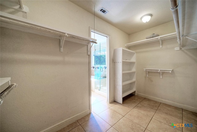3701 Del Robles Dr, Austin, TX 78727 - spacious closet with visible vents and light tile patterned flooring