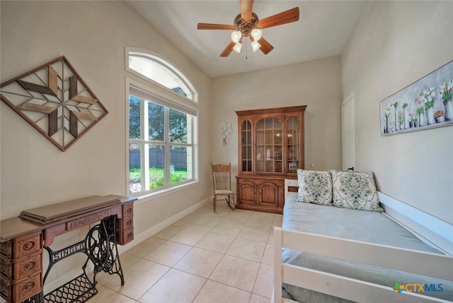 3701 Del Robles Dr, Austin, TX 78727 - living area featuring light tile patterned floors, baseboards, plenty of natural light, and a ceiling fan
