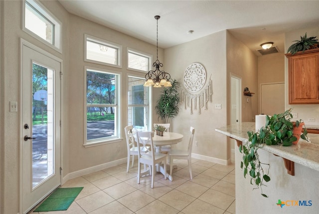 3701 Del Robles Dr, Austin, TX 78727 - dining area featuring light tile patterned floors and a healthy amount of sunlight
