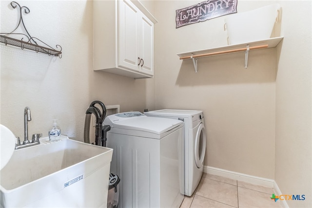 3701 Del Robles Dr, Austin, TX 78727 - laundry area with cabinet space, light tile patterned flooring, a sink, separate washer and dryer, and baseboards