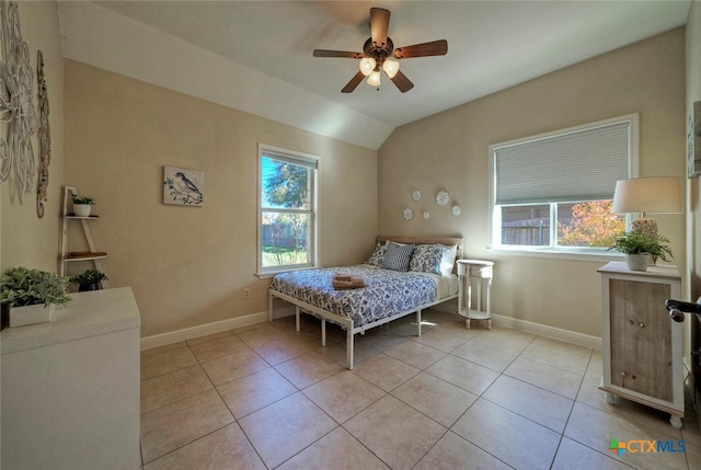 3701 Del Robles Dr, Austin, TX 78727 - bedroom featuring baseboards, light tile patterned flooring, and lofted ceiling