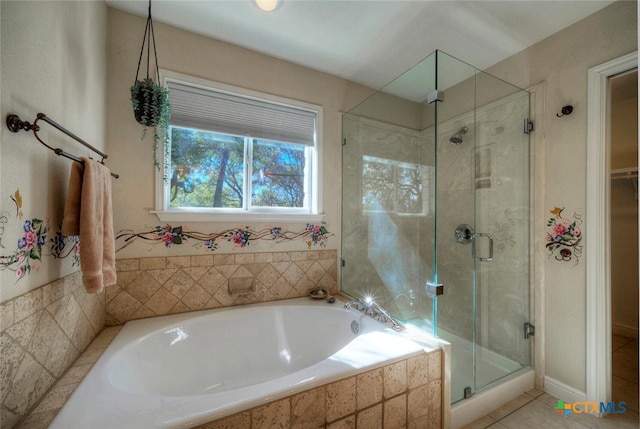 3701 Del Robles Dr, Austin, TX 78727 - bathroom with tile patterned floors, a bath, and a stall shower