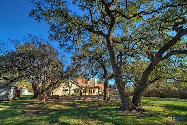3701 Del Robles Dr, Austin, TX 78727 - view of yard featuring fence, an outbuilding, and a shed