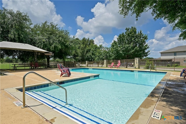 view of pool featuring a patio and a gazebo