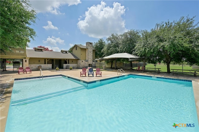 view of pool featuring a patio