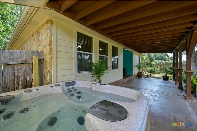 view of patio with a hot tub