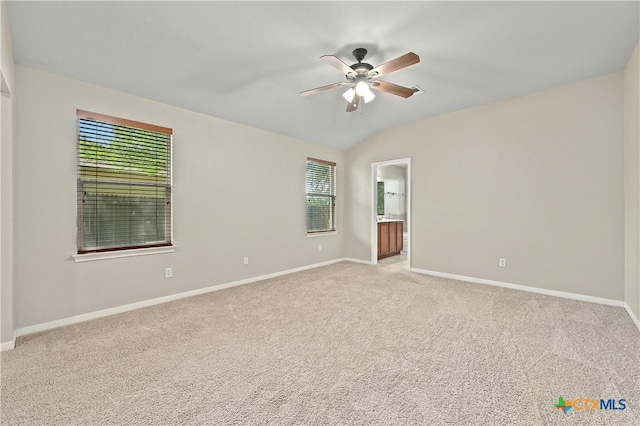 unfurnished room featuring plenty of natural light, light carpet, and ceiling fan