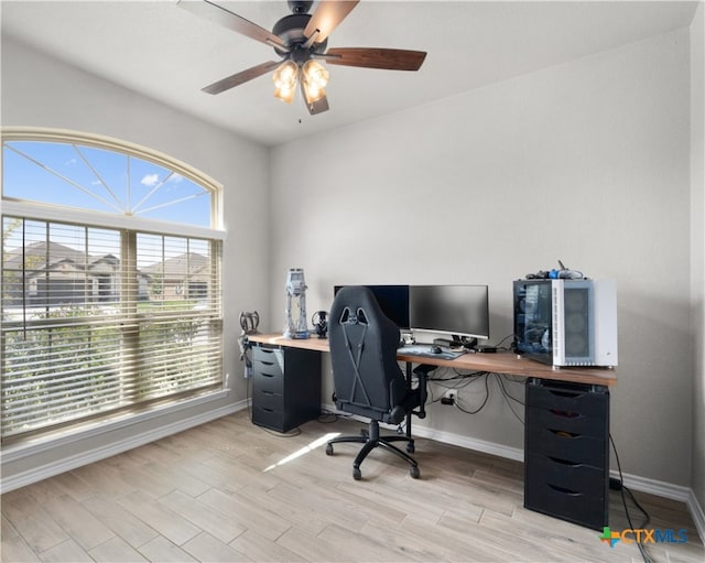 office area with ceiling fan, light hardwood / wood-style floors, and plenty of natural light