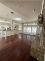 unfurnished living room with dark wood-style floors