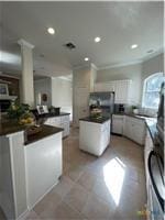 kitchen featuring dark countertops, a center island, and recessed lighting